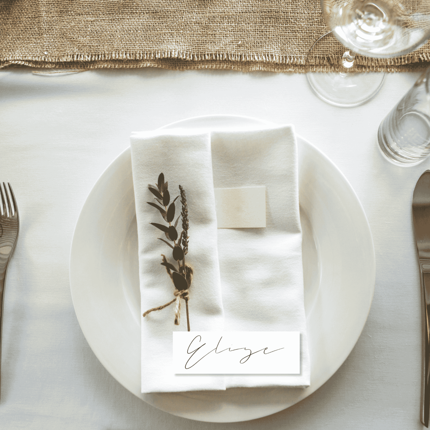 Flora wedding place card styled with linen napkin and foliage for wedding place cards and table settings