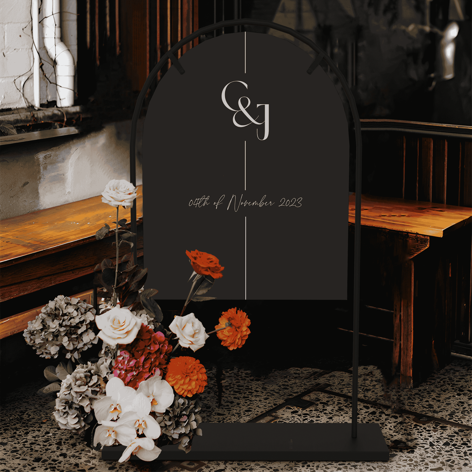 Black Tie wedding welcome sign displayed on stand with florals for wedding signage at indoor wedding event