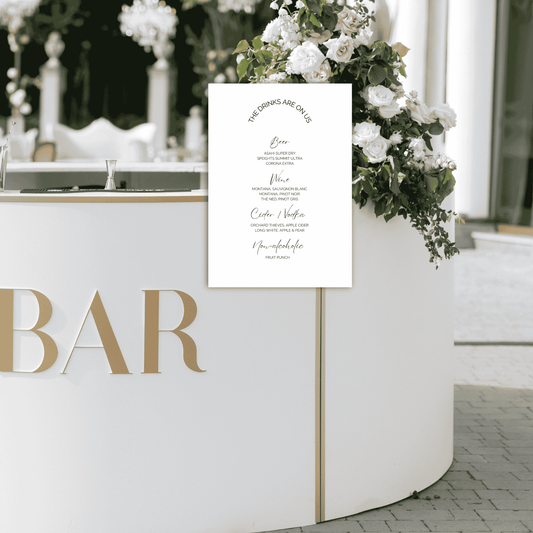 Wedding bar sign displayed on reception bar with floral styling, matching modern wedding decoration