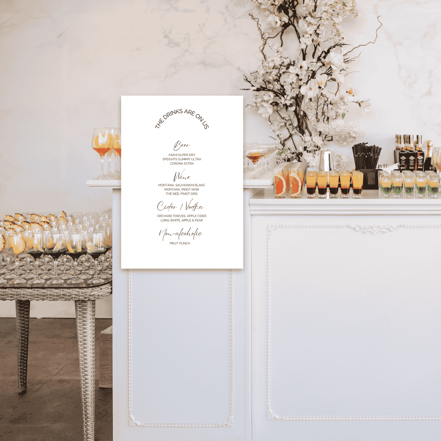 Wedding bar sign styled at drinks station as part of cohesive wedding signage and event design