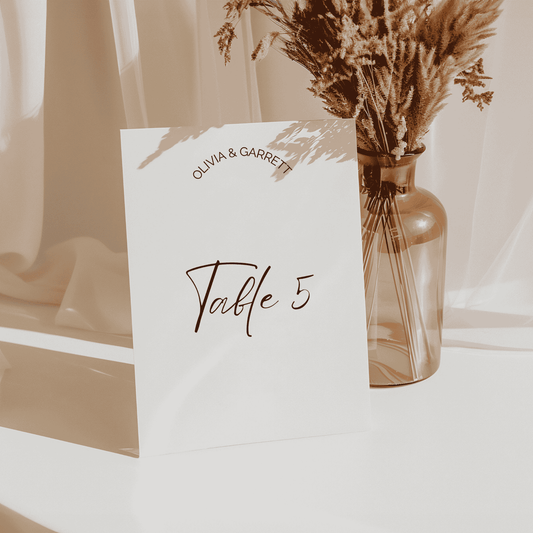 Classic wedding table number card with modern script, styled for reception décor and custom stationery