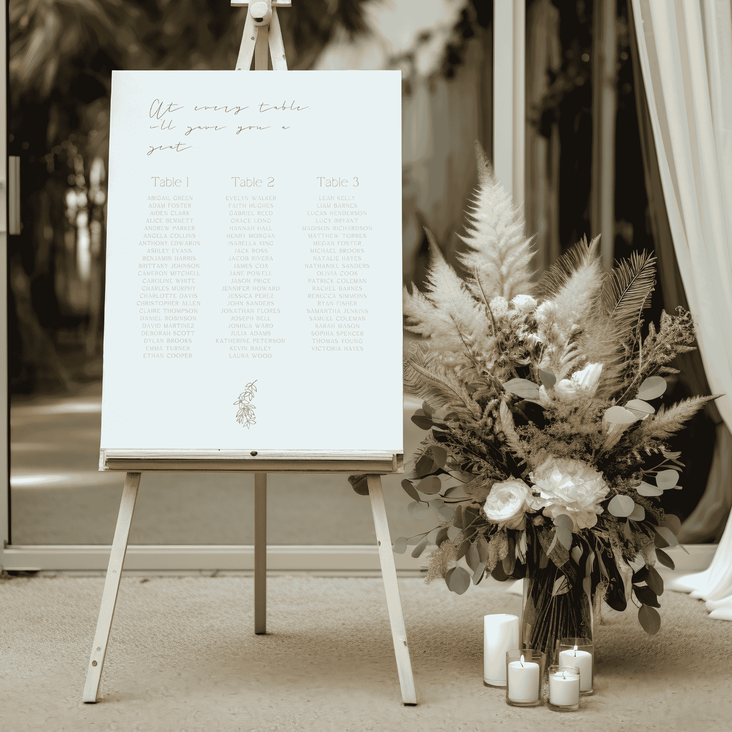 Flora wedding seating chart styled at venue entrance with dried floral arrangement and candles