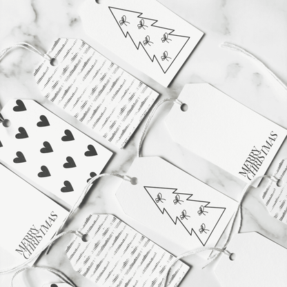 Assorted handmade Christmas gift tags with black heart designs and plain tags, ideal for wedding stationery and Christmas packaging