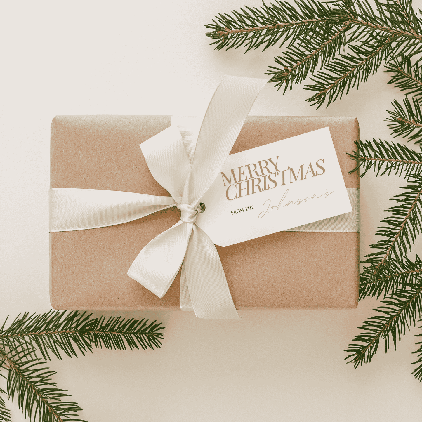 Wrapped gift with personalised Christmas tag and ribbon, handmade stationery accessory for weddings and festive events