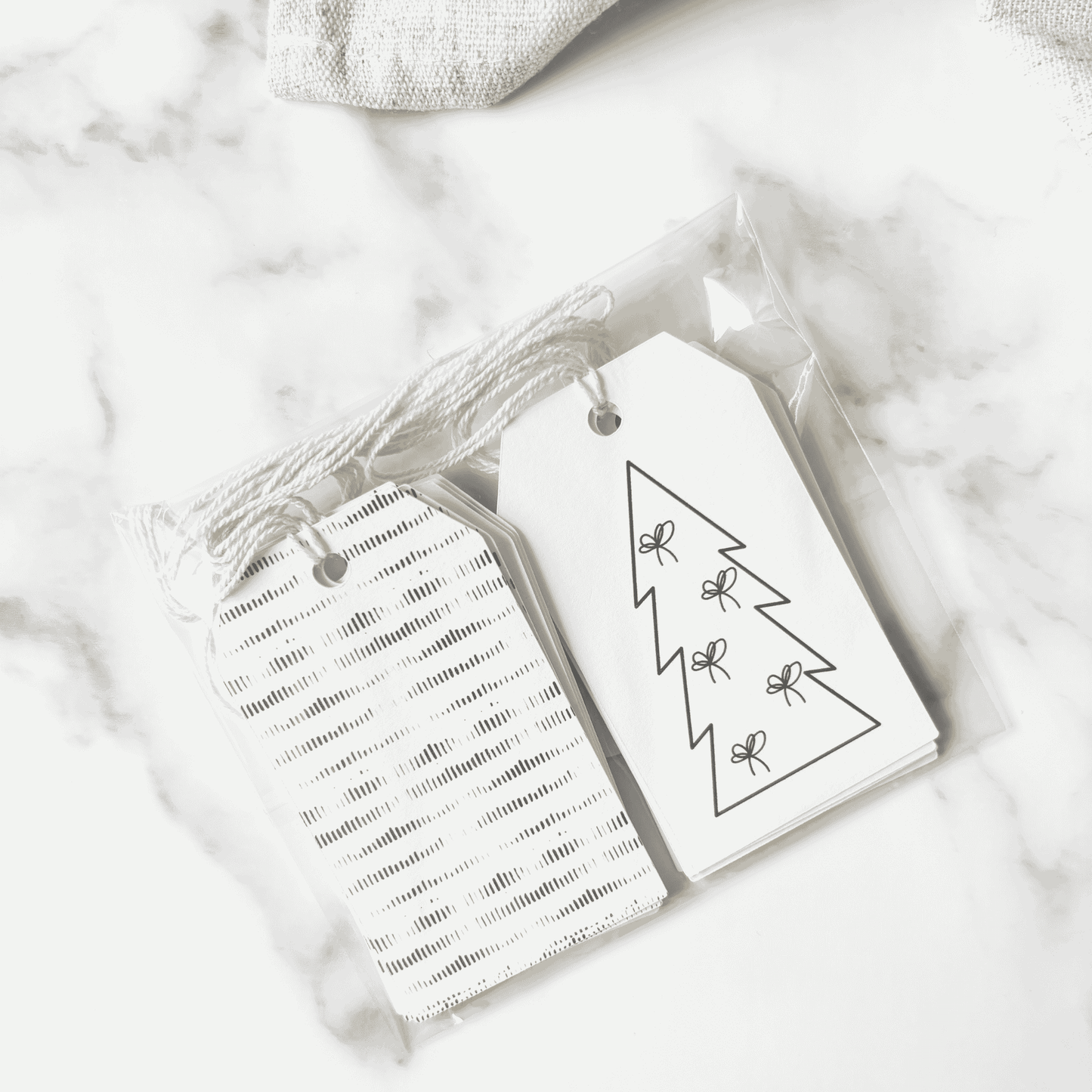 Handmade Christmas gift tags with striped patterns and simple tree illustrations, ideal for Christmas gift wrapping and festive packaging