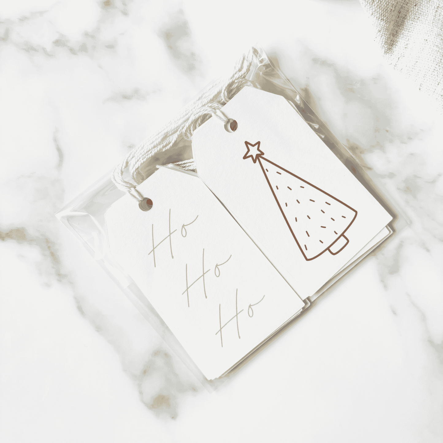 Handmade Christmas gift tags featuring green tree illustrations and Ho Ho Ho text, perfect for Christmas gift wrapping