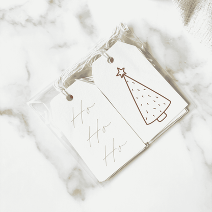 Handmade Christmas gift tags featuring green tree illustrations and Ho Ho Ho text, perfect for Christmas gift wrapping