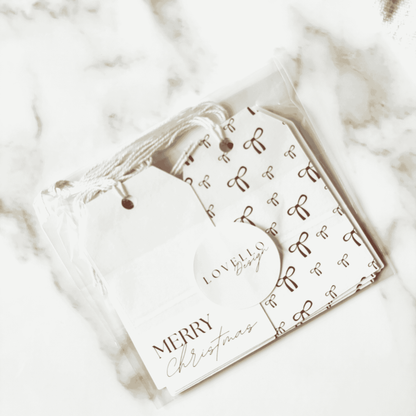 Handmade Christmas gift tags with rust bow pattern and Merry Christmas text, ideal for Christmas gift wrapping and festive packaging