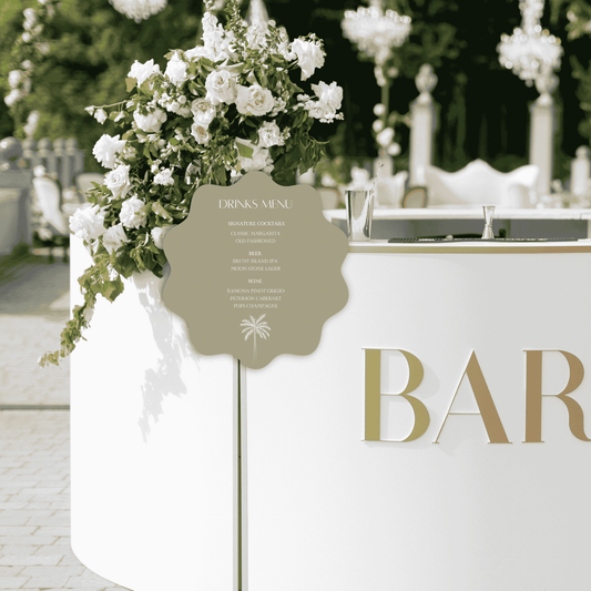 Palm bar sign styled at an outdoor wedding bar with florals, ideal wedding signage for a styled wedding event