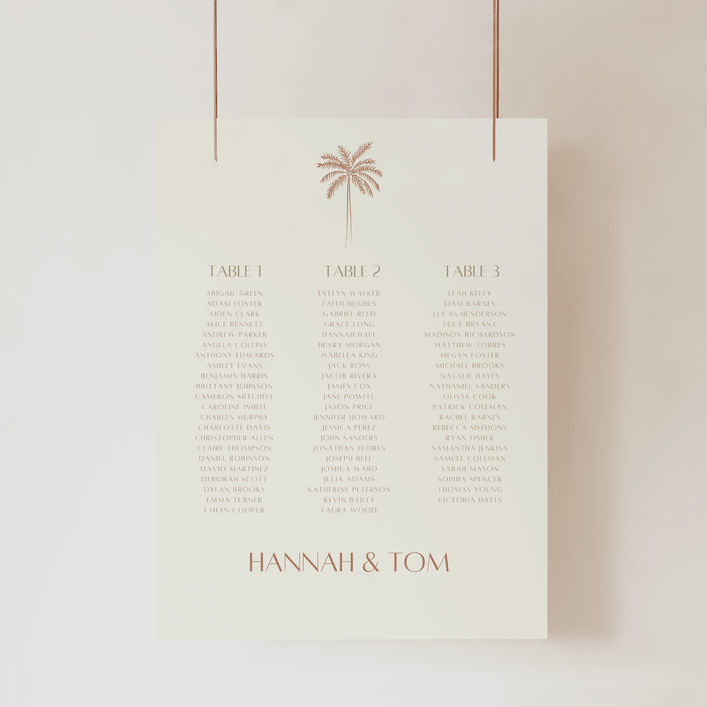 Close-up of Palm wedding seating chart with palm illustration and modern table layout