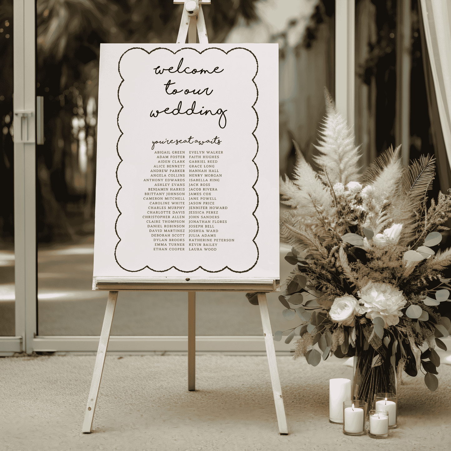 Paris wedding seating sign on easel at venue entrance with dried florals and candles