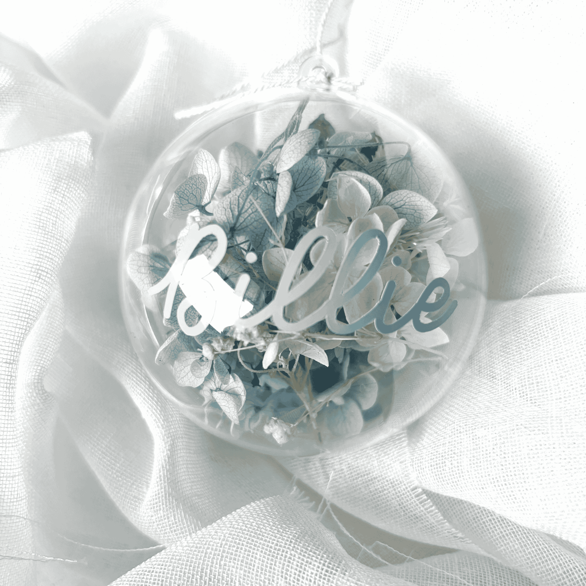 Personalised dried floral Christmas bauble with white and blue flowers, ideal for Christmas tree decoration and festive gifting
