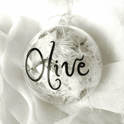Personalised dried floral Christmas bauble with white florals and black name text, perfect for Christmas tree decorating