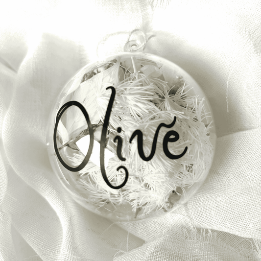 Personalised dried floral Christmas bauble with white florals and black name text, perfect for Christmas tree decorating