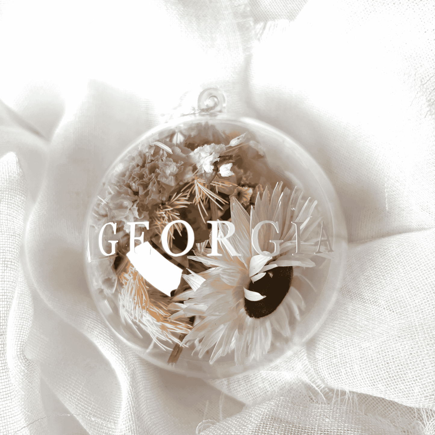 Personalised dried floral Christmas bauble with white and soft purple florals, ideal for Christmas tree display and keepsakes