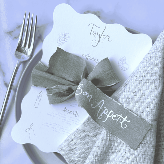 Sage green personalised ribbon styled with menu, ideal for wedding table signs or custom stationery