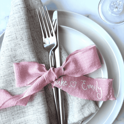 Personalised pink wedding ribbon with names, ideal for custom wedding stationery or table decoration