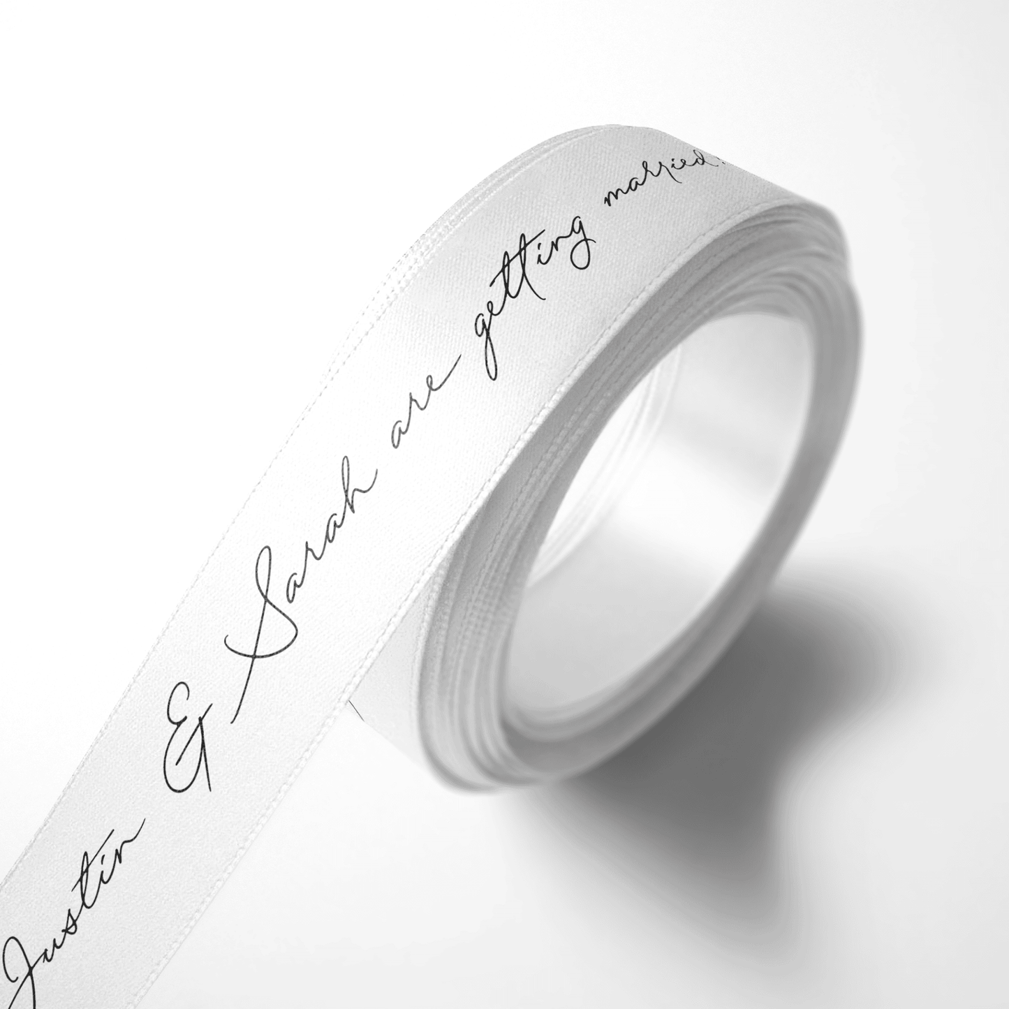 Personalised white ribbon with black script print for weddings, events and custom gift wrapping
