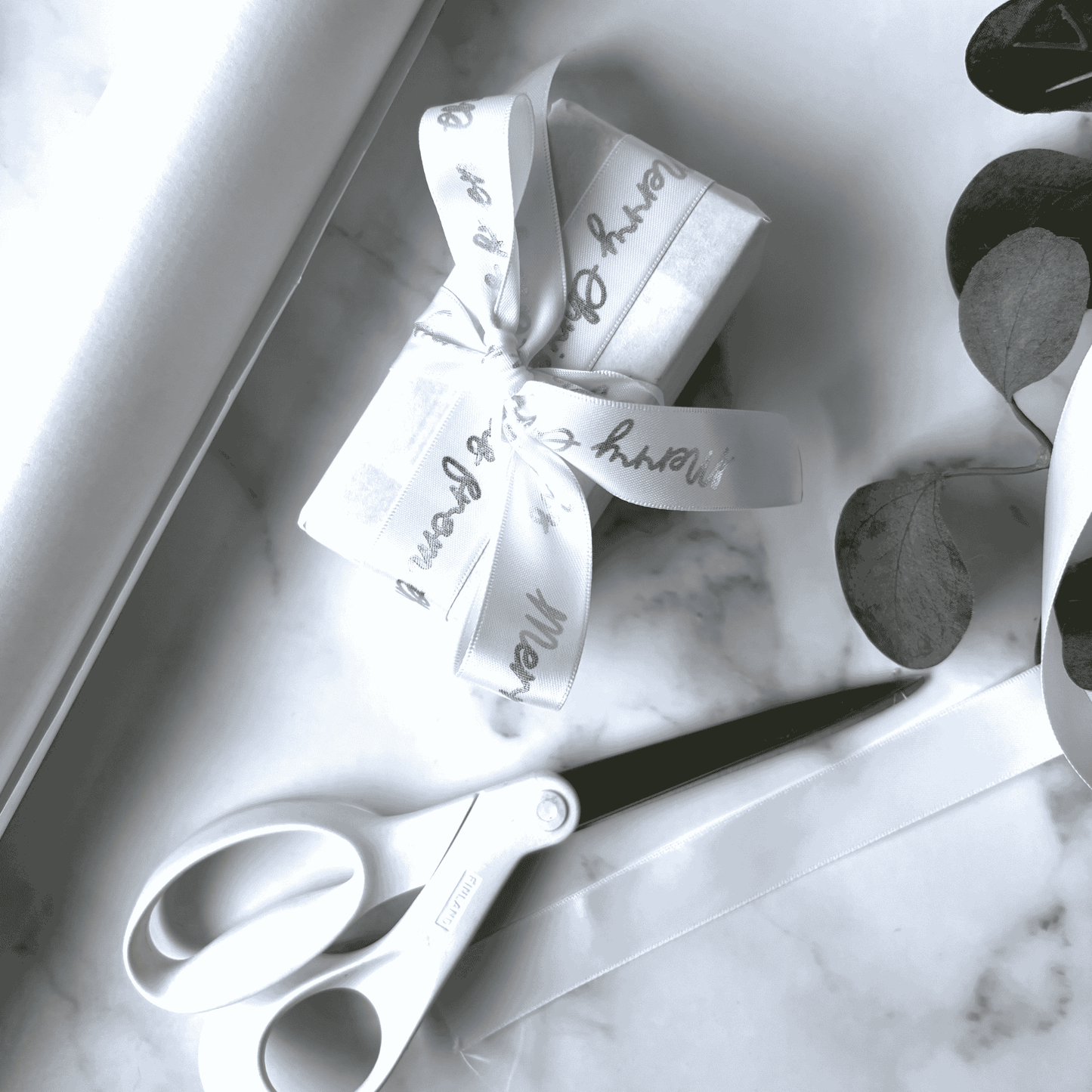 White personalised ribbon with metallic silver print for wedding invitations and stationery