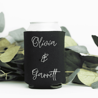Black personalised wedding stubby holder styled with foliage for wedding favours and wedding event decoration