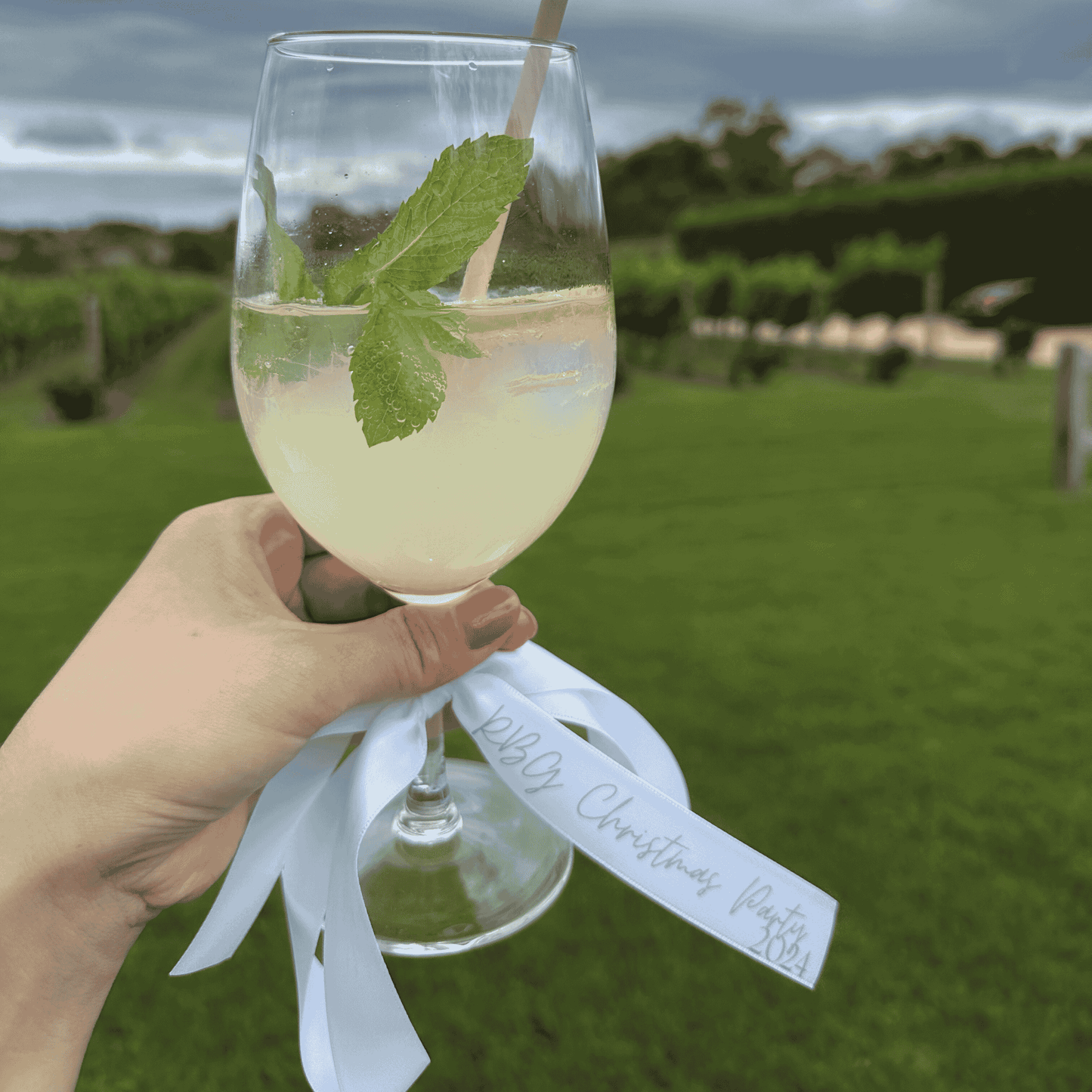 White satin personalised ribbon on cocktail glass vineyard wedding favours wedding table settings dream wedding