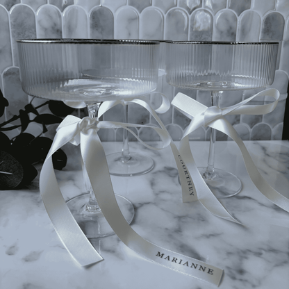 White satin custom ribbon with black print for wedding place cards on glassware wedding table settings