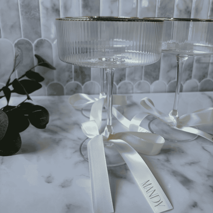 White satin ribbon with silver print for wedding place cards on coupe glasses wedding table settings accessories wedding