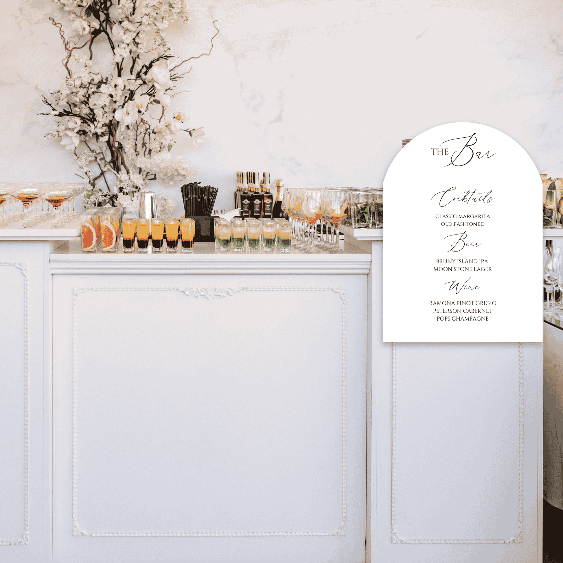 Romance wedding bar sign displayed on modern indoor bar, part of matching wedding signage and event design