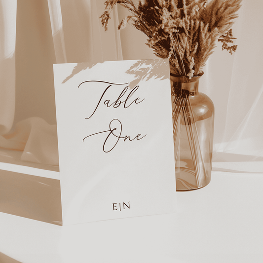 Table number wedding sign styled for reception décor, matching wedding stationery and table settings